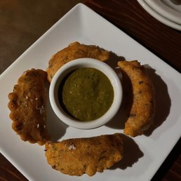 La Merenda signature dishes Beef EmpanadasEmpanadas VegetarianasButter Chicken